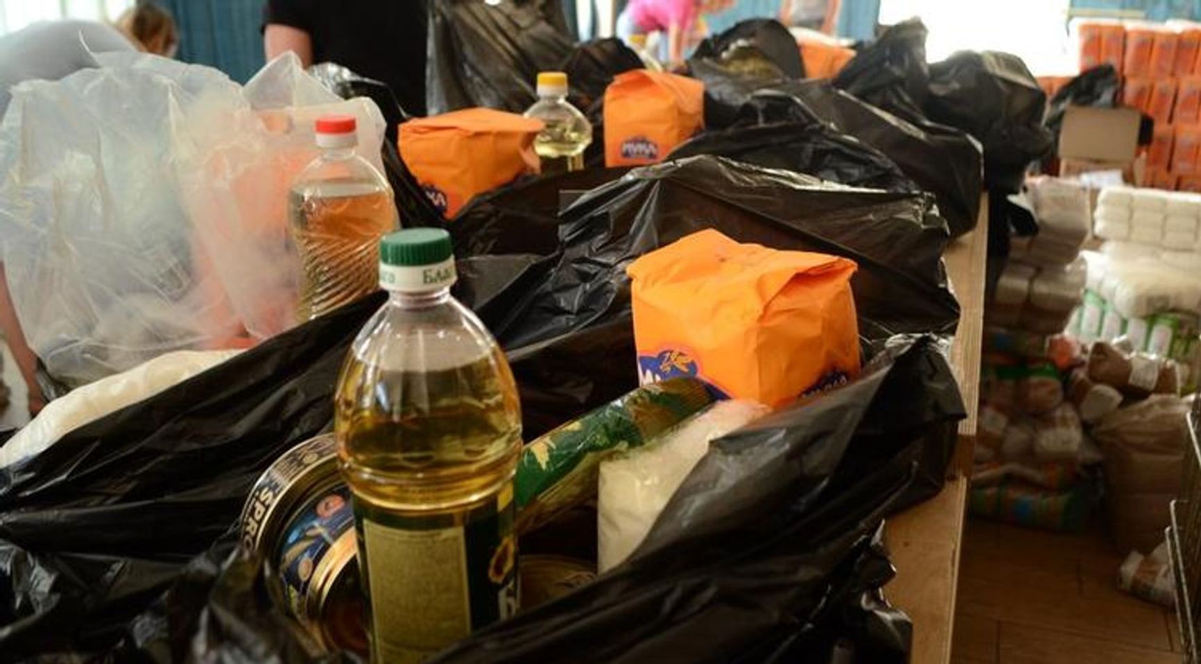 Volunteers collect packages for soldiers